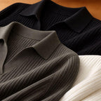 Three ribbed knit polo shirts in black, olive, and cream colors on a flat surface.