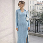 Woman in light blue ribbed knit v-neck long sleeve dress with slit, outdoor setting